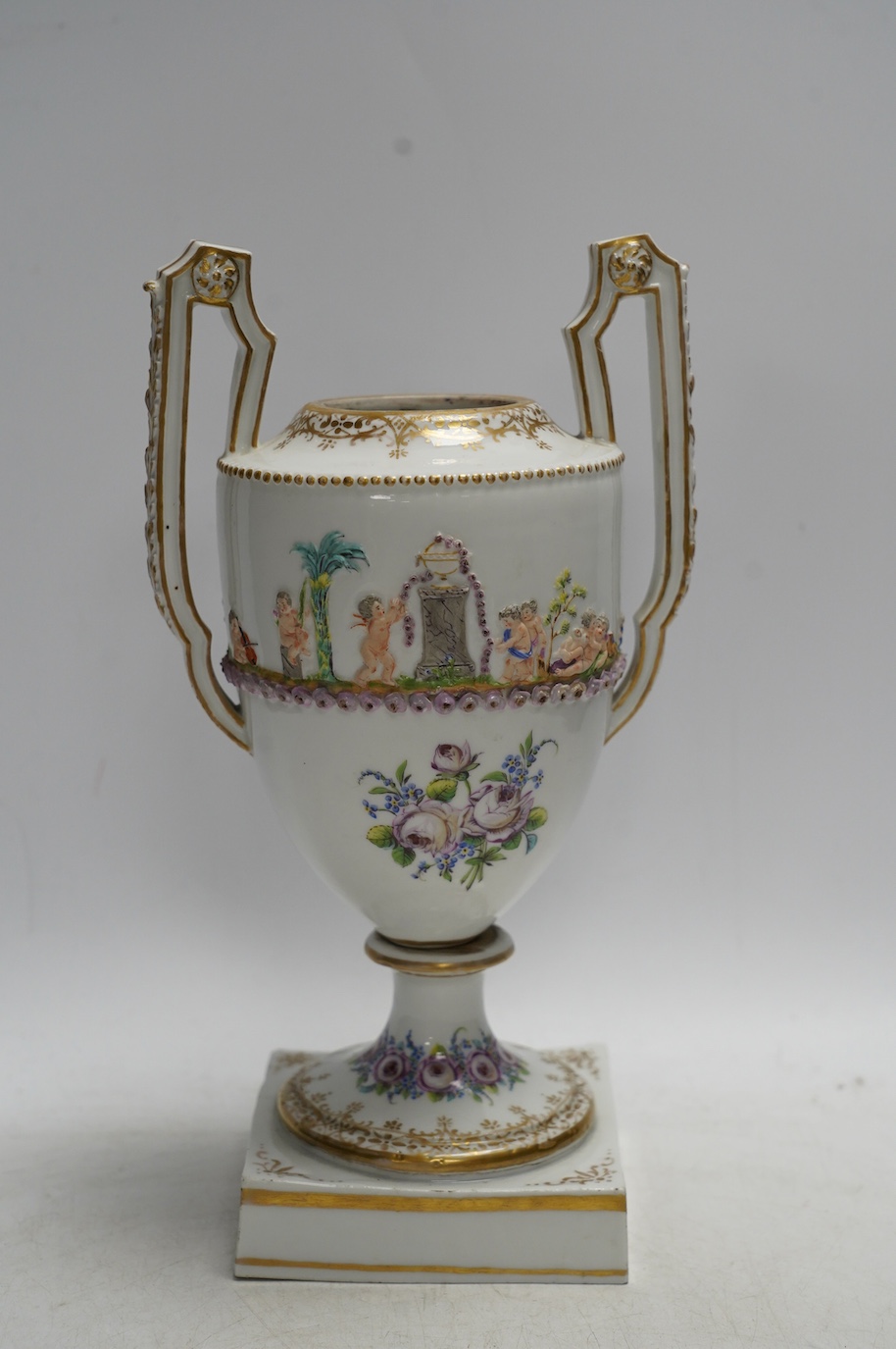 A Capodimonte / Naples style urn, early 19th century 26cm. Condition - poor (base cracked)